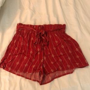 Red flowy shorts with adjustable bow